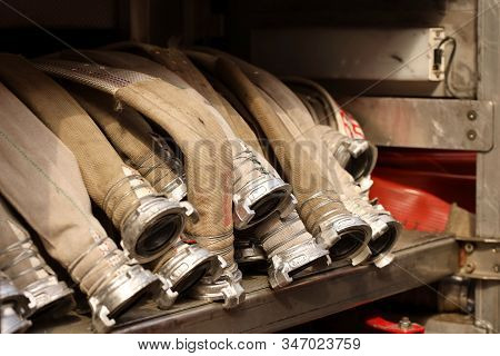 Fire Hoses For High Pressure Water Supply With Quick Connecting Locks Are Stacked On Top Of Each Oth