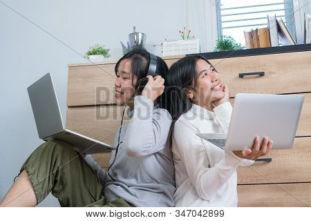 Asian Entrepreneur Students Laughing Studying E-learning Online With Headphones Tablet And Laptop Co