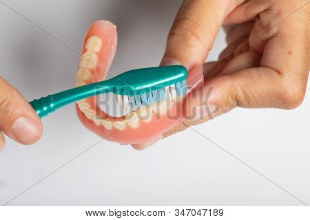 Cleaning Dental Prothesis With Toothbrush