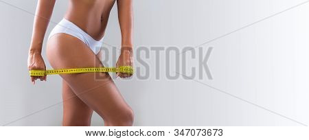 Close Up Of Measuring Tape Over Slim Female Hips, Afro Lady In Underware Measuring Her Legs, Panoram