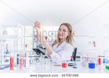 Pretty Scientist Work Reserching In Chemical Laboratory, Science And Healthy Or Medical Concept