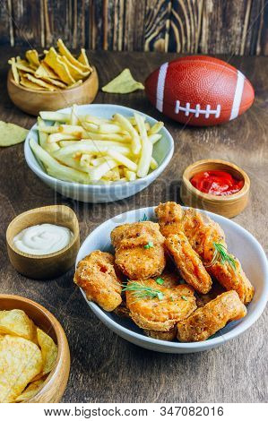 Table Fof Tasty Snacks And Beer Prepared For Watching Sports On Tv. Selective Focus