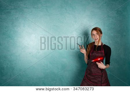 Smiling Girl Hairdresser Holds Fan And Scissors In Hands