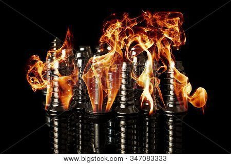 Lot Of Metal Silver Bolts Burning Fire Isolated On Black Glass
