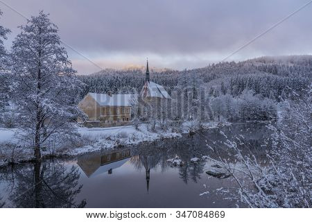 Blue Cloudy Morning With Fog And Church In Loucovice Village