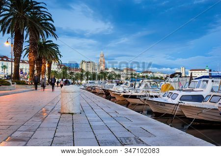 Split, Croatia - May 21, 2019: Beautiful Riva Promenade With Palm Trees Near Matejuska Port With Sma