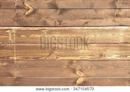 Close Up Of Wall Made Of Wooden Planks. Brown Horizontal Boards For Use As A Background Or Wallpaper