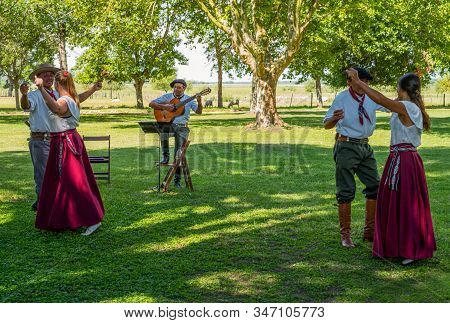 Areco, Argentina - January 22,2018:  Gauchos With Their Women Dancing At A Traditional Folk Fest In 