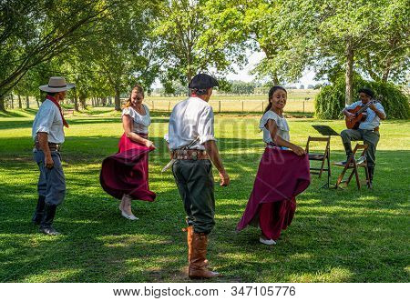 Areco, Argentina - January 22,2018:  Gauchos With Their Women Dancing At A Traditional Folk Fest In 