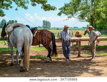 Areco, Argentina - January 22,2018:  Gauchos And Horses In A Country Farm 70 Miles Northwest Of Buen