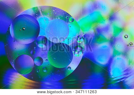 Colorful Abstract Background With Gradient Green Blue And Yellow Colors, Oil Drops In Water Abstract