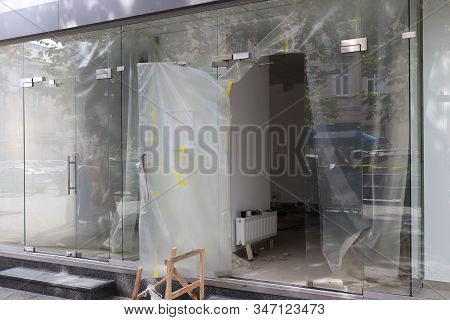 Repair Of A Modern Room With Glass Walls And Entrance Doors. Construction And Design Of A Trading Pl