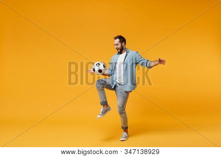 Cheerful Young Man In Casual Blue Shirt Posing Isolated On Yellow Orange Wall Background, Studio Por