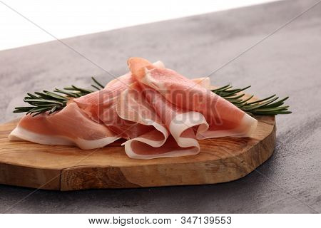 Dry Spanish Ham, Jamon Serrano, Bellota, Italian Prosciutto Crudo Or Parma Ham. Meat Cutting