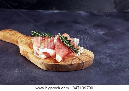 Dry Spanish Ham, Jamon Serrano, Bellota, Italian Prosciutto Crudo Or Parma Ham. Meat Cutting