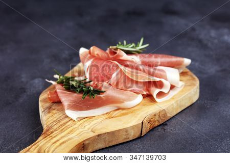 Dry Spanish Ham, Jamon Serrano, Bellota, Italian Prosciutto Crudo Or Parma Ham. Meat Cutting