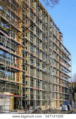 Scaffolding Arround The House To Install Thermal Insulation Of The Apartment Building Facade