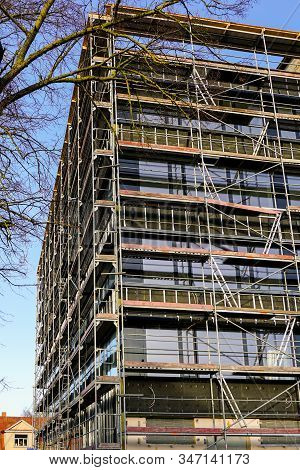Scaffolding Arround The House To Install Thermal Insulation Of The Apartment Building Facade