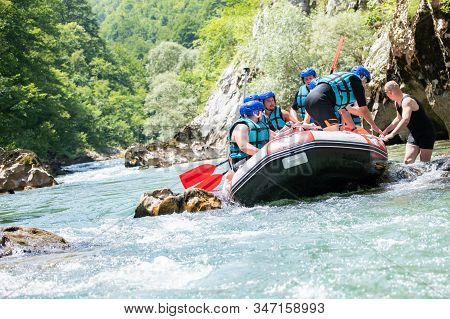 Rafting Team Stucked On The River And Trying To Get Out