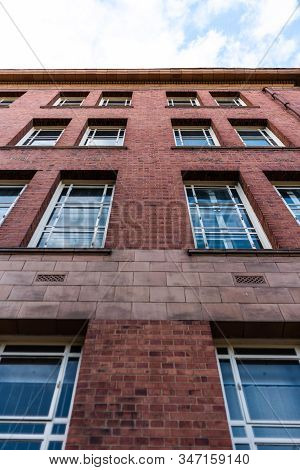 Fascade Of Historic University Manchester Building Blue Sky
