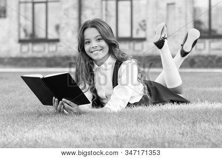 The Book Is Genius. Genius Bookworm Relax Reading On Green Grass. Happy Little Genius Read Book Outd