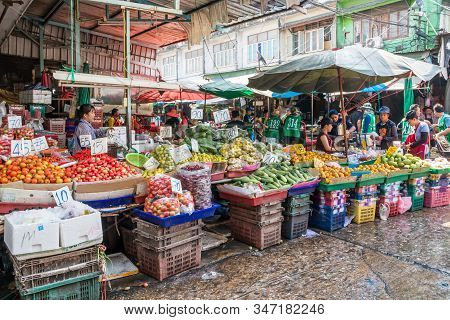 Bangkok, Thailand - January 9th 2020: Fruit And Vegetable Stalls On Khlong Toei Wet Market. This Is 