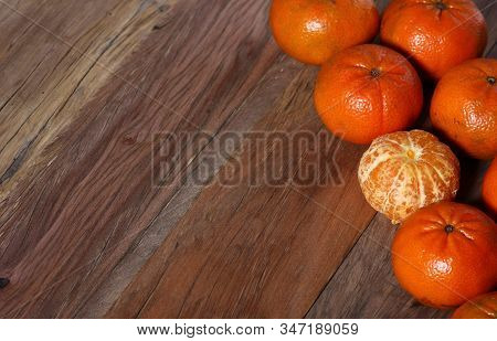 Uicy Tangerines Laid Out On A Dark Wood Texture Table
