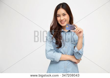 Young Beautiful Asian Woman Smiling, Showing, Presenting Credit Card For Making Payment Or Paying On