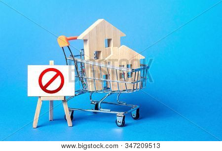 Houses In A Shopping Cart And Easel Red Prohibition Sign No. Inaccessibility, Lack Housing, Deficit.