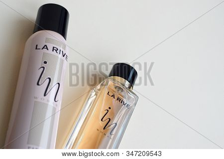 La Rive In Woman Deodorant And Perfume Bottles On Beige Background. La Rive S.a. Is One Of The Leadi