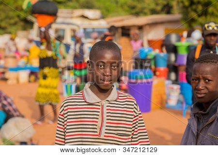 Bissau, Guinea-Bissau - January 5, 2020: portrait of African Kids looking at the camera in rural Guinea-Bissau