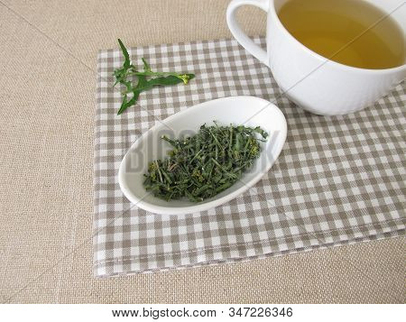 A Cup Of Tea With Dried Hedge Mustard