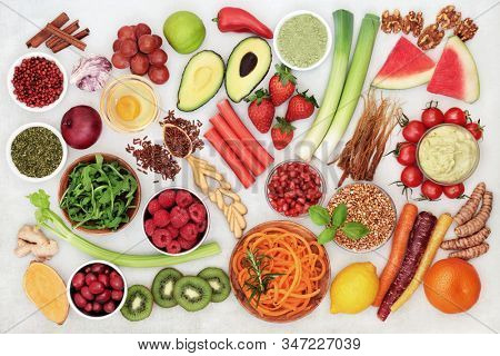 Super food collection for good health with health foods high in antioxidants, anthocyanins, vitamins, minerals, protein, omega 3 and fibre   Flat lay.