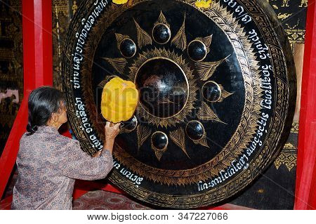 Luang Prabang, Laos - April 14, 2012: Woman Prays In Xieng Thong Temple In Luang Prabang, Laos. Wat 