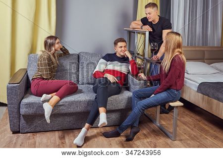Student Party With Light Alcoholic Drinks In Residence Hall Of University. Drunk Undergrads On Campu