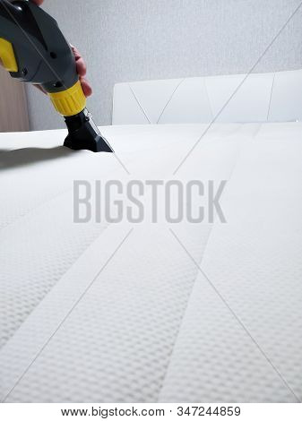 Dry Cleaning Of The White Mattress On The Bed. Wet Cleaning.