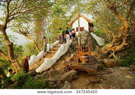 Luang Prabang, Laos - April 15, 2012: People Visit Wat Chom Si Temple At Phou Si Hill In Luang Praba