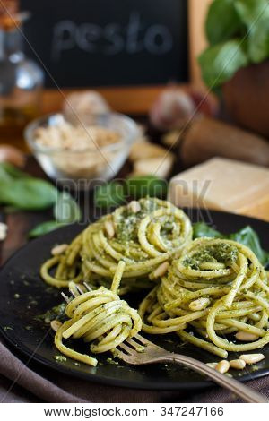 Spaghetti Pasta With Pesto Sauce, Basil, Pine Nuts And Parmesan Close Up