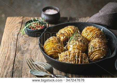 Baked Hasselback Potatoes With Cheese, Garlic And Greens