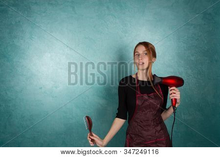Smiling Girl Hairdresser Holds Fan And Scissors In Hands