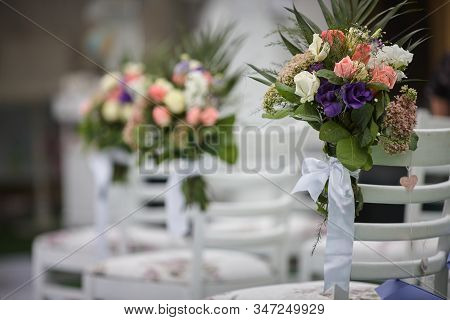 Chairs For Wedding Guests. Wedding Decorations. Flowers