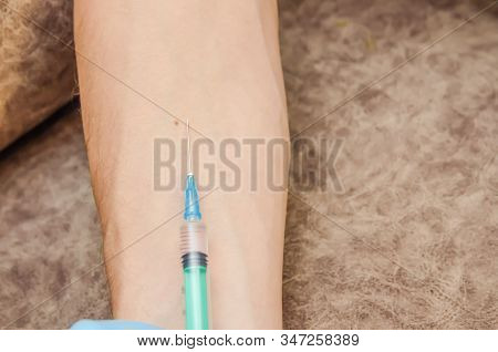 Female Doctor Conducts A Mantoux Test For A Man In A Clinic. Hand And Syringe Close-up