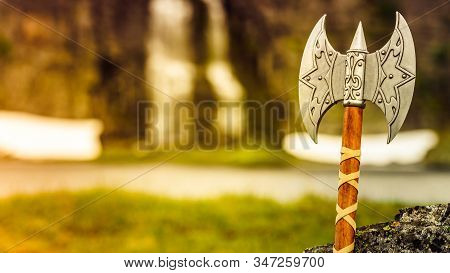 Equipment Of Viking Or Barbarian Warrior Outdoor On Nature. Viking Axe Against Norwegian Nature. Tou