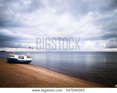Fishing Boat On Baltic Sea Coast. Stormy Weather. Mechelinki, Poland, Pucka Bay.