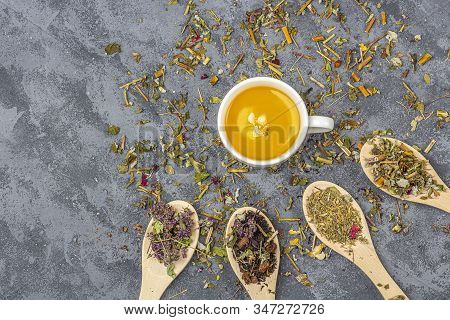 Assortment Of Different Dry Tea Leaf In Wooden Spoons And Cup Of Green Tea. Organic Herbal, Green As