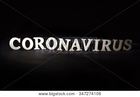 Word Coronavirus On A Black Background. Deadly Viral Disease Concept, Medicine And Vaccine For Virus