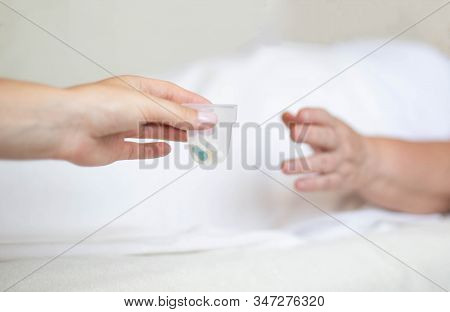 Doctor Holds Out Anti-hypertension Pills And Antidepressants To An Elderly Woman, Pill Classificatio
