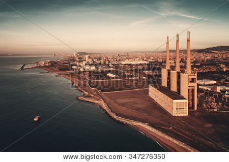 Besos thermic power plant aerial view at sunrise in Barcelona coast Spain.