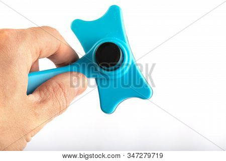 Hand Holding Comb For Pet Grooming Isolated On White Background