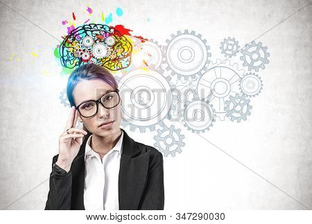 Thoughtful Woman In Glasses Brainstorming